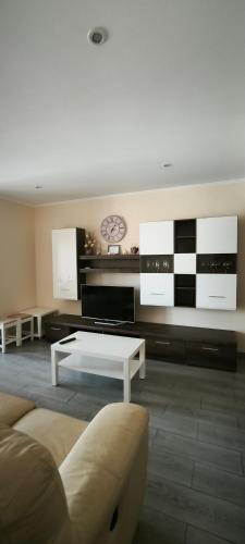 a living room with a couch and a coffee table at Rocha Apartment Plus in Portimão