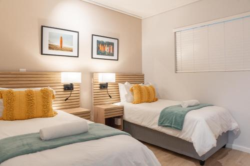 Katil atau katil-katil dalam bilik di Ocean Glow Apartment 214