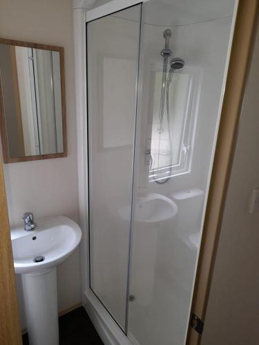 a bathroom with a shower and a sink at The Chillout in Knaresborough
