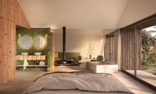 a bedroom with a large bed and a fireplace at Nature Retreat by Herdade do Ananás in Ponta Delgada