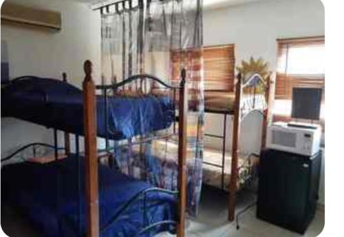 Postel nebo postele na pokoji v ubytování Palmitas Hostel