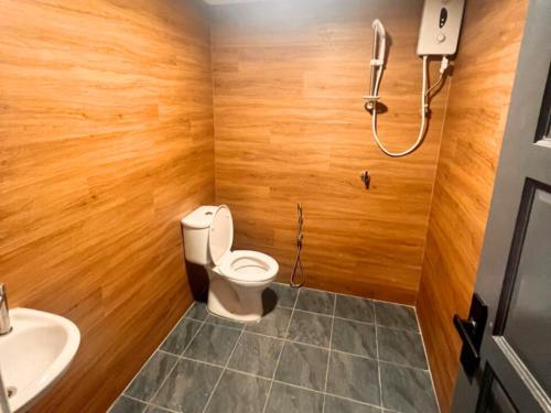 a bathroom with a toilet and a sink at Seeds Hotel Premier Chow Kit Kuala Lumpur in Kuala Lumpur