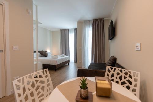 Ένα ή περισσότερα κρεβάτια σε δωμάτιο στο Bovio28studios