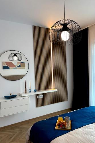 Postel nebo postele na pokoji v ubytování Exigent Chic Apartments