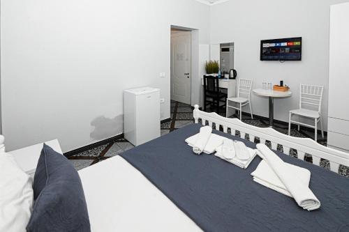 Ένα ή περισσότερα κρεβάτια σε δωμάτιο στο Hotel Fama