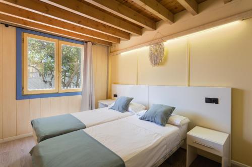 Ένα ή περισσότερα κρεβάτια σε δωμάτιο στο Oliwood Beach - Gigi