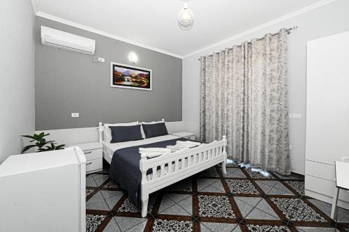 Ένα ή περισσότερα κρεβάτια σε δωμάτιο στο Hotel Fama