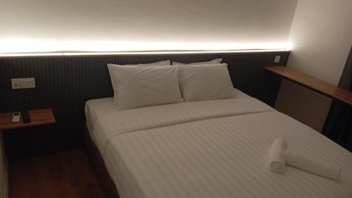 Postel nebo postele na pokoji v ubytování T Hotel SP Pekan Lama