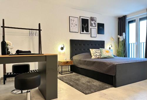 a bedroom with a bed and a desk at Stylish Unit in Komarna - Idyllic Retreat in Komarna