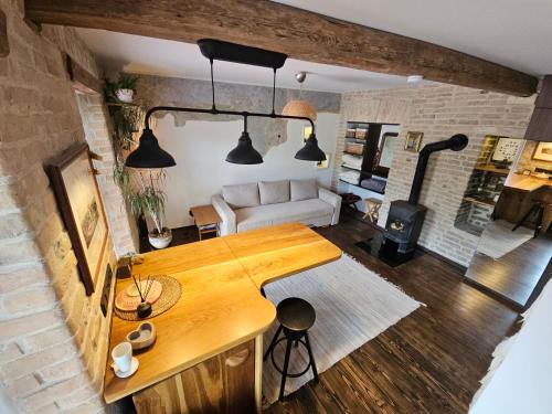 a living room with a table and a couch at Paupio Gertruda in Vilnius