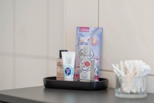 a counter with a box of toothpaste and other products at Ferienwohnung Fritz am Bauhausmuseum in Dessau