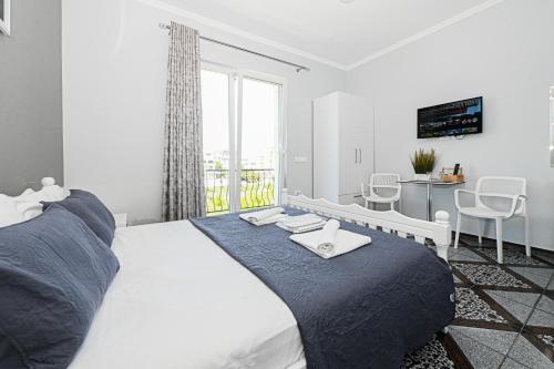 Postel nebo postele na pokoji v ubytování Hotel Fama