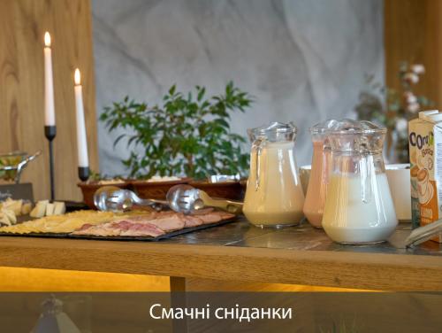 two containers of milk sitting on a table at Chalet Fomich in Bukovel