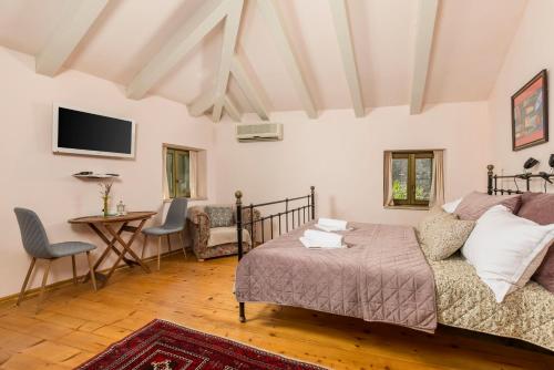 a living room with a couch and a desk at Dei Fiori Apartments in Rovinj