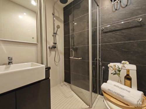 a bathroom with a shower and a toilet and a sink at Country Garden by Antlerzone in Johor Bahru