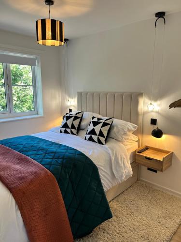 a bedroom with a bed and a window at Niamh's Place in Northallerton