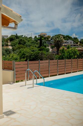 a view of a swimming pool in a house at Aristides Cottage in Kassiopi