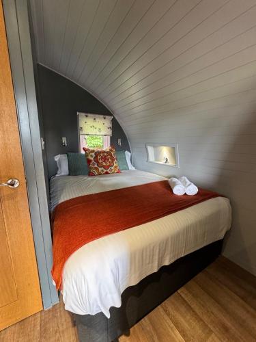 a bedroom with a large bed in a room at All Manor Of Events - Glamping Pods in Henley