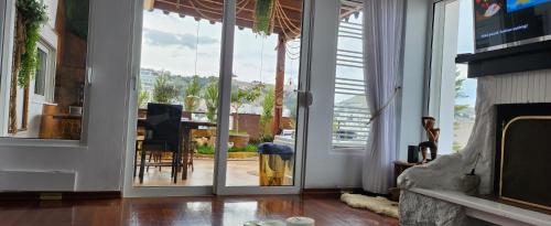 a living room with a sliding glass door at Eye Luxury Penthouse in Sarandë