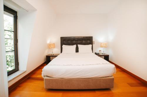 Postel nebo postele na pokoji v ubytování Eirado Hotel