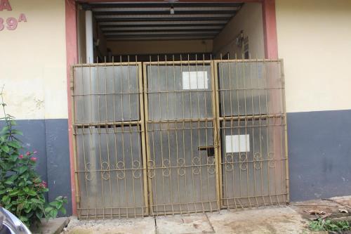 a metal gate in front of a building at Guest House Griya Mas BCI A 39A in Gadobangkong
