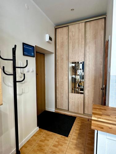 a living room with a door and a room with at Like-a House Centrum in Płock