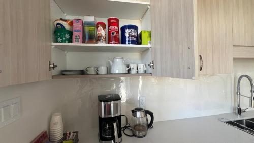 a kitchen counter with a coffee maker in a cupboard at Entire Home in Lake of Bays -Huntsville Muskoka Algonquin in Dwight