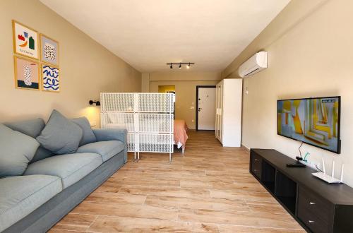 a living room with a couch and a bedroom at Demir Point Suites by Villa Safiya in Göcek