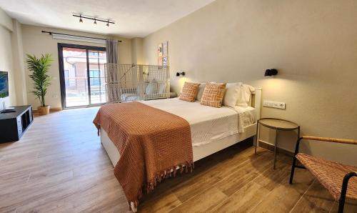 a bedroom with a large bed and a large window at Demir Point Suites by Villa Safiya in Göcek