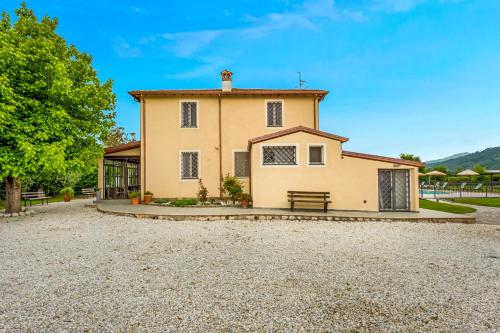 a large house with a gravel driveway at VISTALAGO VERSILIA in Massarosa