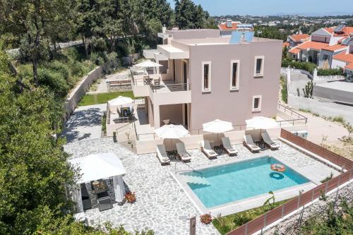 an aerial view of a villa with a swimming pool at Oasis Luxury Villa in Rhodes Town