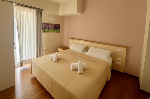 Ένα ή περισσότερα κρεβάτια σε δωμάτιο στο Margherita Rooms