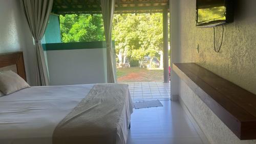 Katil atau katil-katil dalam bilik di Pousada do Rio Turvo