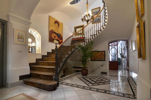 a staircase in a home with a chandelier at La Casa de los Coy in Mula