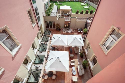 an overhead view of an outdoor patio in a building at Hotel Indigo Verona - Grand Hotel Des Arts by IHG in Verona