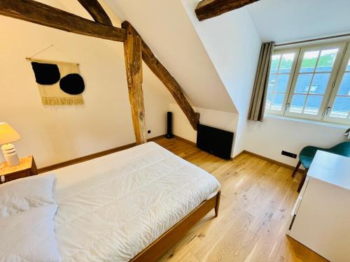 Giường trong phòng chung tại Le BIG duplex, hypercentre, 4 chambres, spacieux