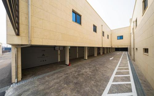 an empty hallway of a building with a garage at Restia Incheon Bay Hotel in Incheon