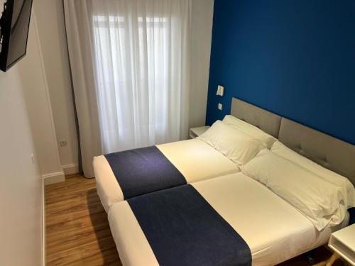Ένα ή περισσότερα κρεβάτια σε δωμάτιο στο Casual Blue