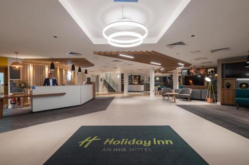 an image of the lobby of a hotel at Holiday Inn Bristol Airport by IHG in Redhill