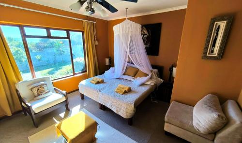 Postel nebo postele na pokoji v ubytování Beachfront VILLA AFRICAN QUEEN