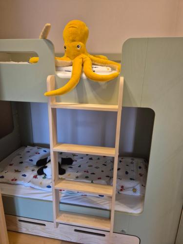 a stuffed animal is sitting in a bunk bed at Lindengut Natternbach in Natternbach