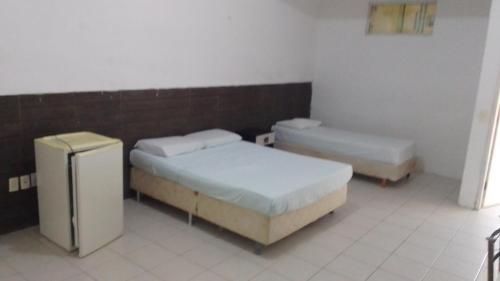 Katil atau katil-katil dalam bilik di Hotel Belas Artes