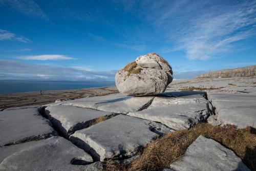 a large rock sitting on top of a mountain at The Turning of The Tide in Fanore
