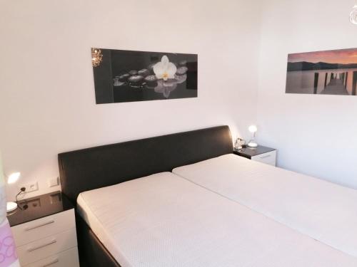 Ένα ή περισσότερα κρεβάτια σε δωμάτιο στο 4 Ferienwohnung Franziska