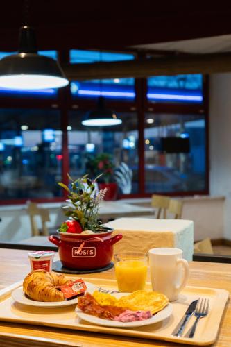 a tray of breakfast food on a table at Autohof Hotel Salzbergen in Salzbergen