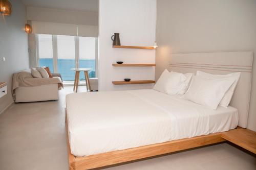 Ένα ή περισσότερα κρεβάτια σε δωμάτιο στο Elia Suites