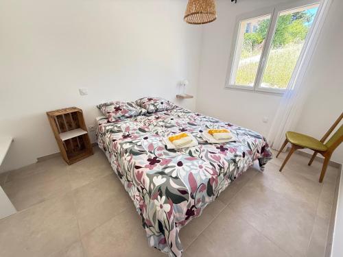 a bedroom with a bed and a chair and a window at Villa Santa - Piscine - Wi-Fi - Proche Ventoux - idéal Cyclistes in Mormoiron
