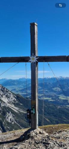 a cross on the top of a mountain at Appartement Kammblick in Gröbming