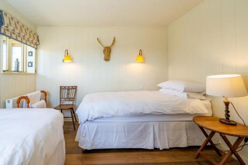Postel nebo postele na pokoji v ubytování Snow Hall Barn