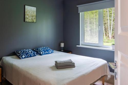 Postel nebo postele na pokoji v ubytování Jõeranna Pond House